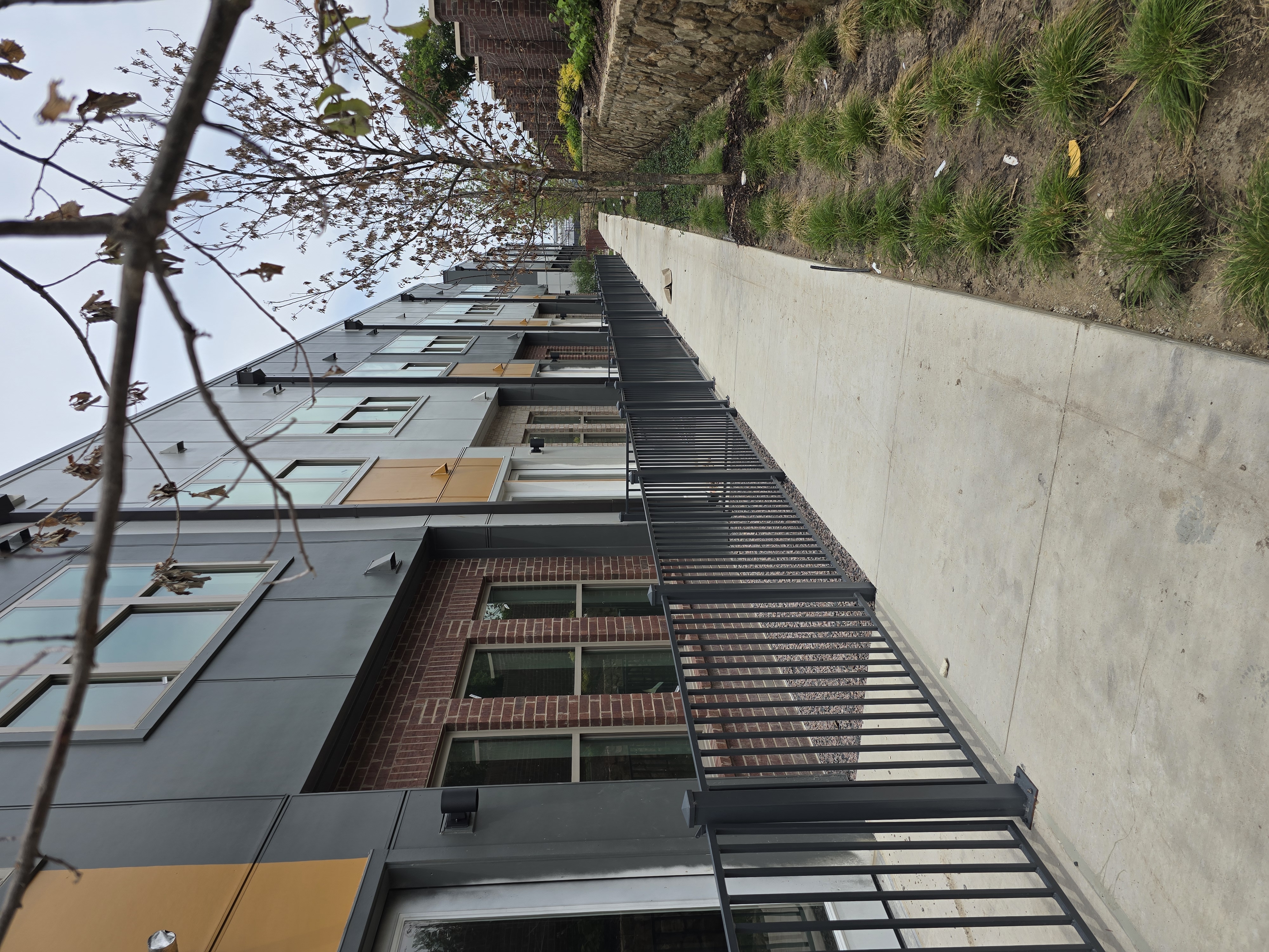 Welded steel and powder-coated aluminum perimeter fencing by Yellow Rose Steel